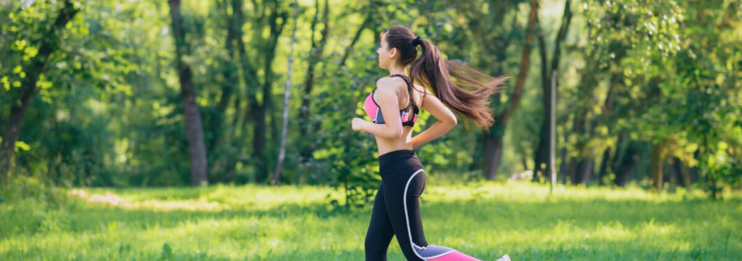 Girl running energetically through a vibrant spring meadow.