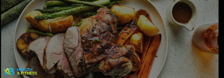 Golden, herb-crusted Australian Christmas roast lamb served with roasted potatoes, carrots, and asparagus, the perfect festive centerpiece for a holiday meal.