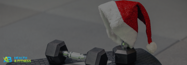 Dumbbell with Santa hat to stay motivated this December fitness routine.