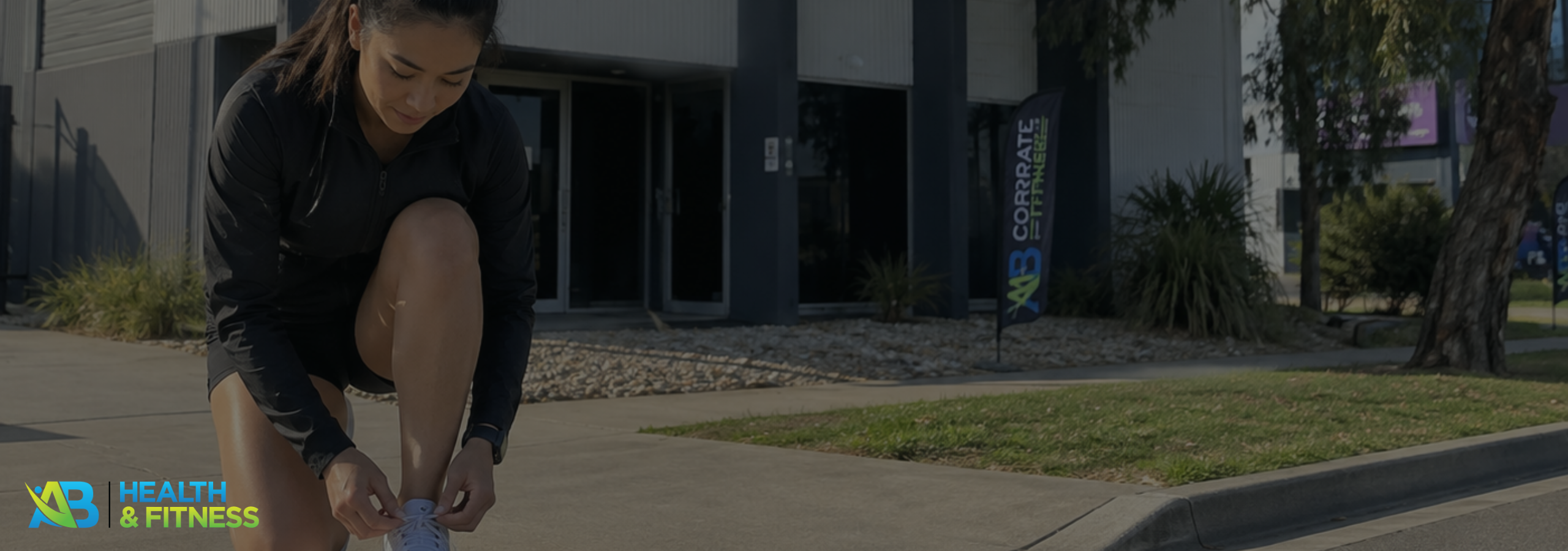 Person tying running shoes outdoors on a crisp September morning