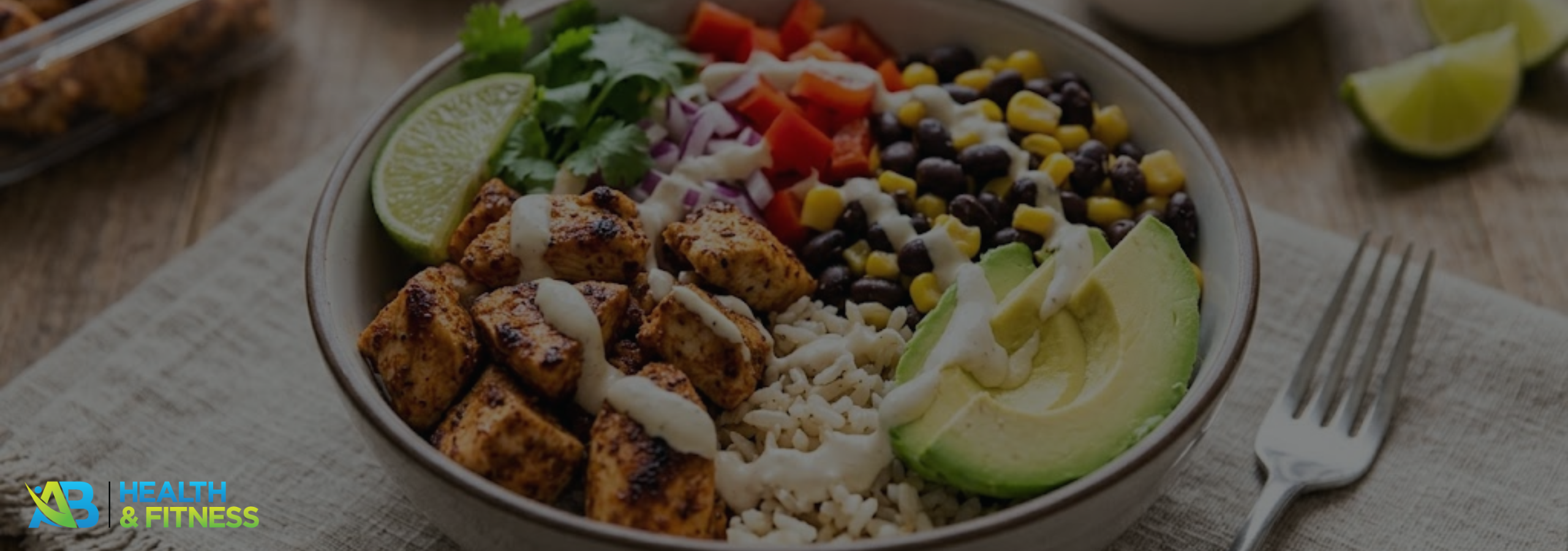 High-protein chicken burrito bowl with rice, beans, avocado and fresh vegetables
